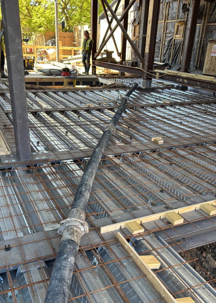 A King Concrete Pumping line pump feeding concrete on site near Dulwich